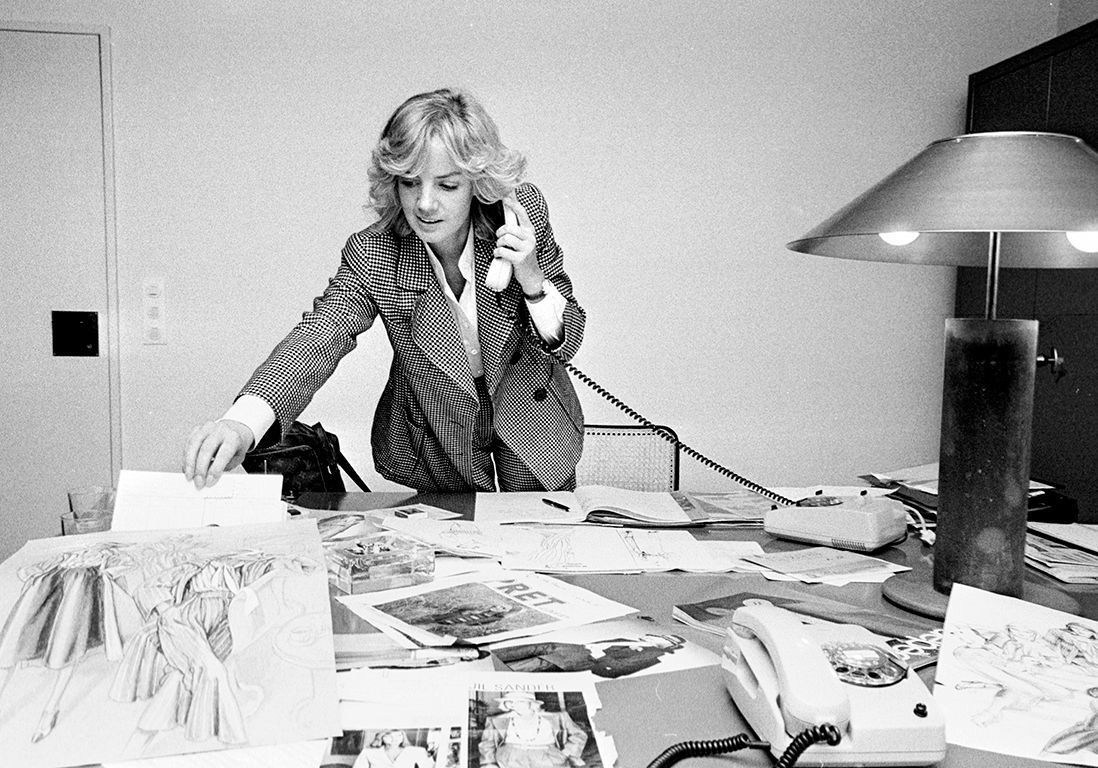 Jil Sander Dressed in a Women's Suit Working in her Office