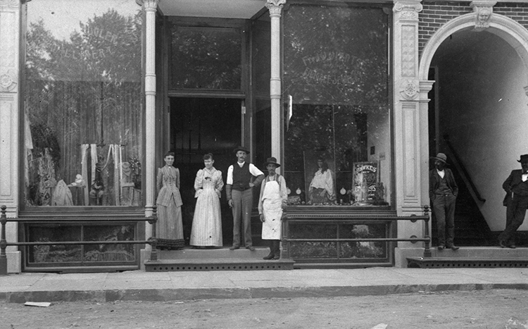 Shopkeepers standing outside the Catron Building