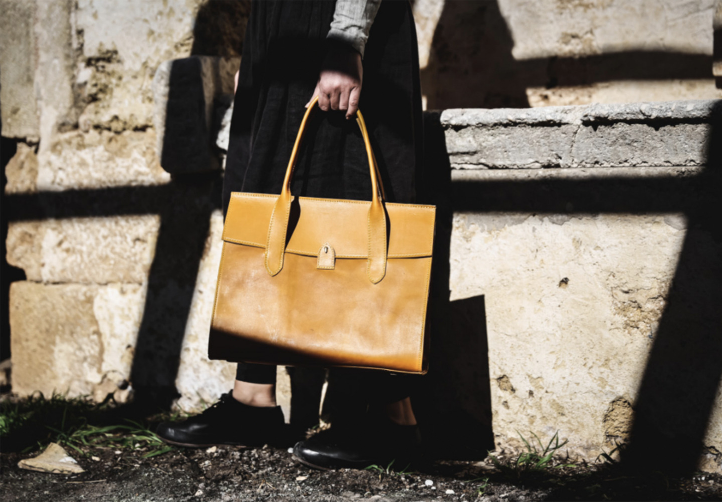 Woman Holding Corîu Bitta Style Italian Leather Handbag